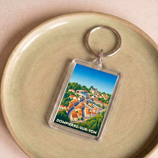 Porte-clés souvenir de la ville de Dompierre-sur-Yon avec une illustration stylisée.