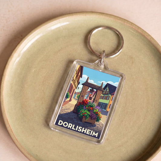 Porte-clés souvenir de la ville de Dorlisheim avec une illustration colorée et stylisée.