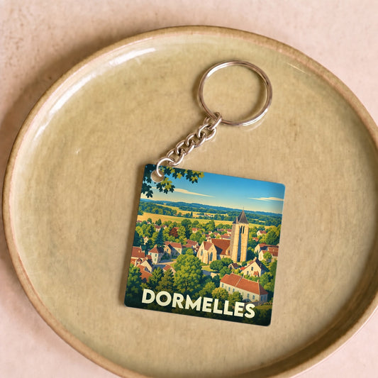 Porte-clés souvenir de la ville de Dormelles avec une illustration stylisée.