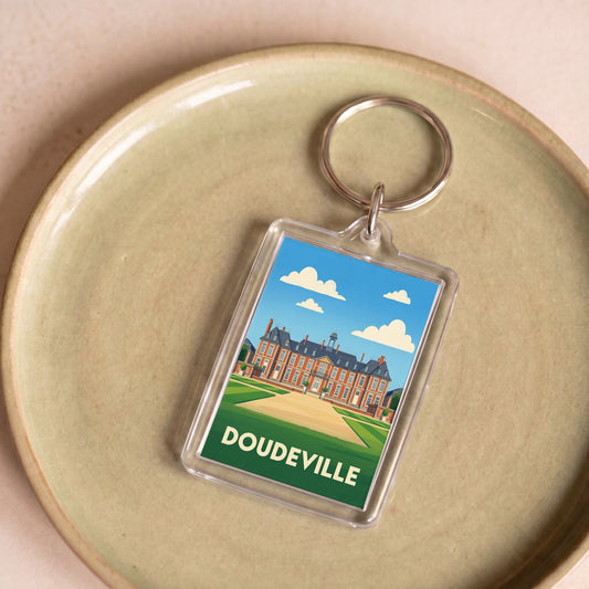 Porte-clés souvenir de la ville de Doudeville avec une illustration stylisée.