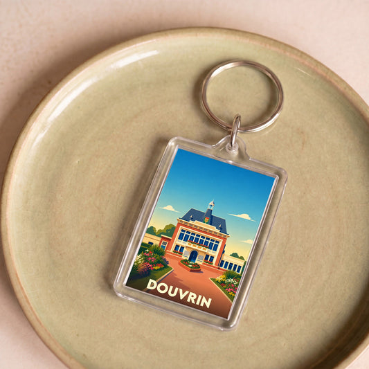 Porte-clés souvenir de la ville de Douvrin avec une illustration stylisée de son hôtel de ville.