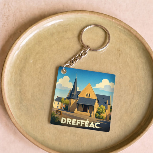 Porte-clés souvenir de la ville de Drefféac avec une illustration stylisée.