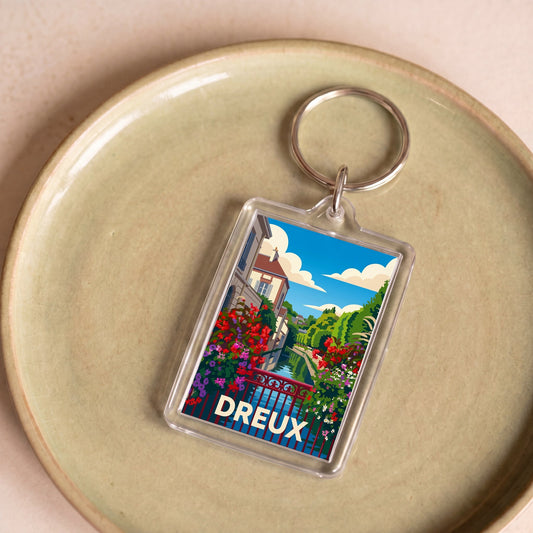 Porte-clés souvenir de la ville de Dreux avec une illustration stylisée et colorée.