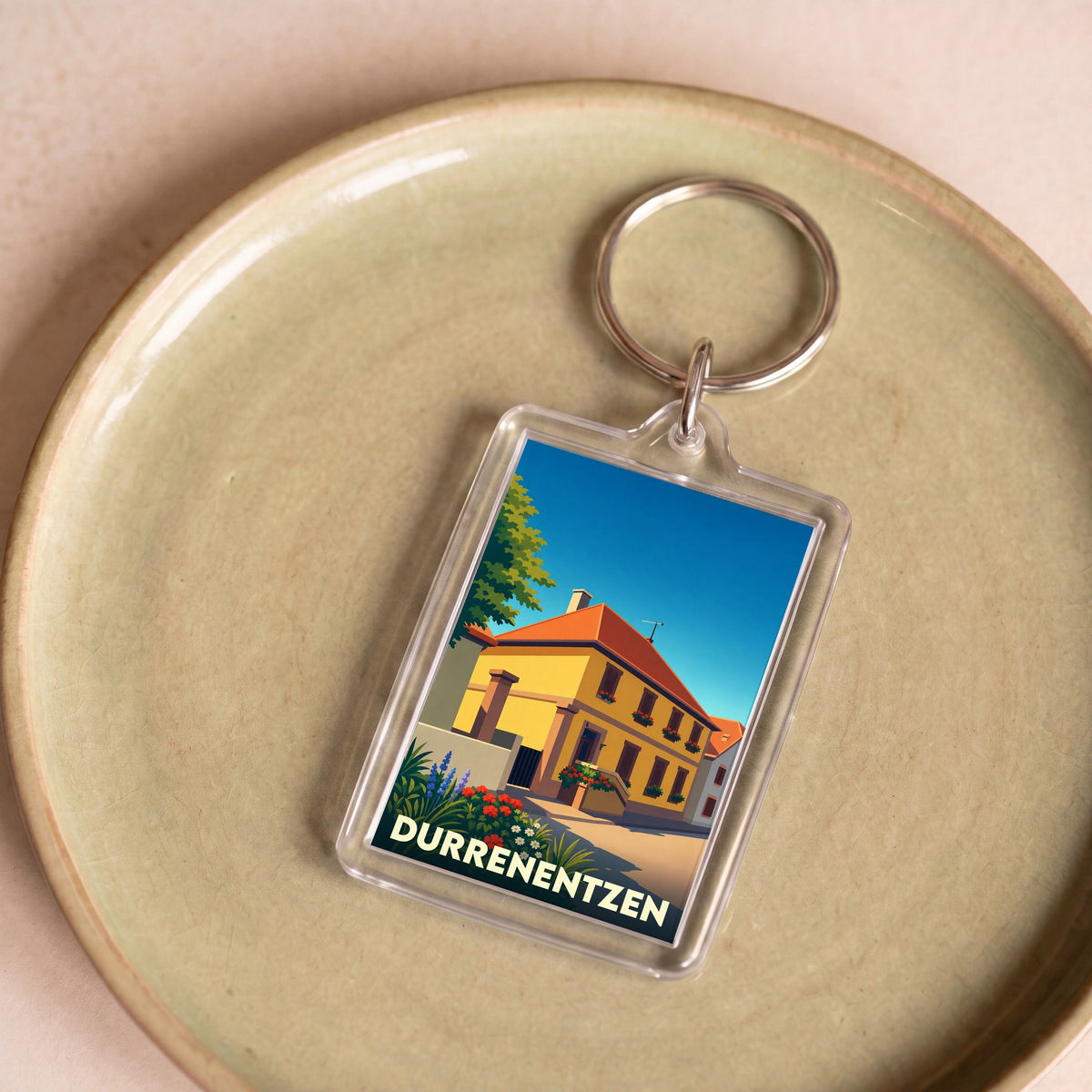 Porte-clés souvenir de la ville de Durrenentzen avec une illustration stylisée.