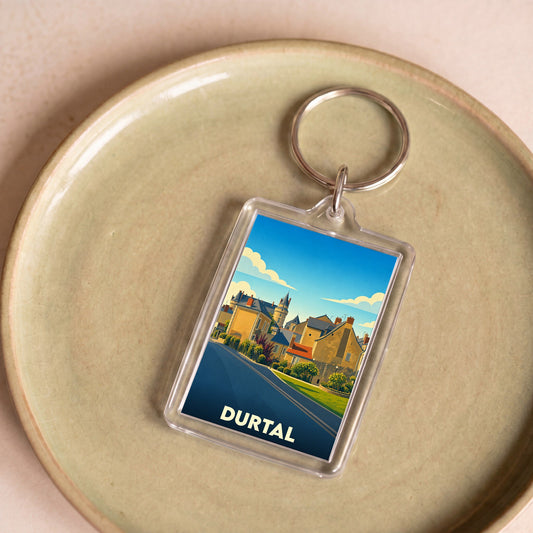 Porte-clés souvenir de la ville de Durtal avec une illustration stylisée.