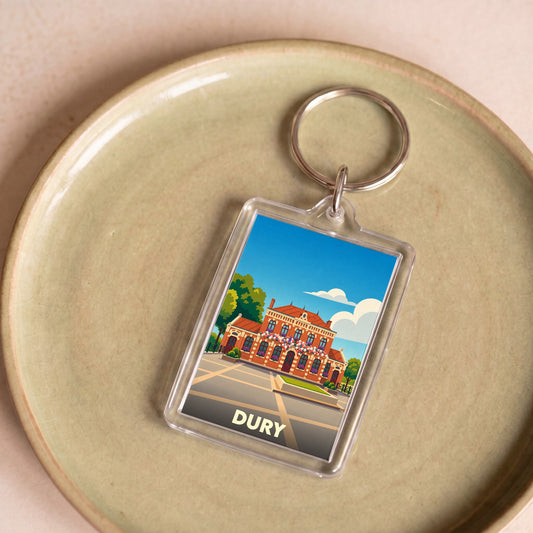 Porte-clés souvenir de la ville de Dury avec une illustration stylisée de sa mairie.