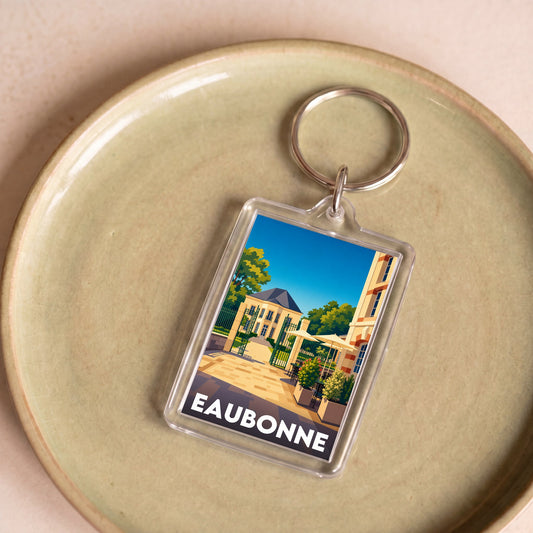 Porte-clés souvenir de la ville d'Eaubonne avec une illustration stylisée.