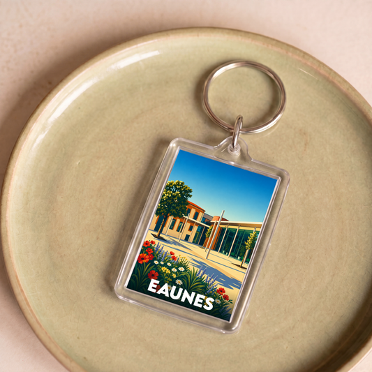 Porte-clés souvenir de la ville d'Eaunes avec une illustration colorée et stylisée.