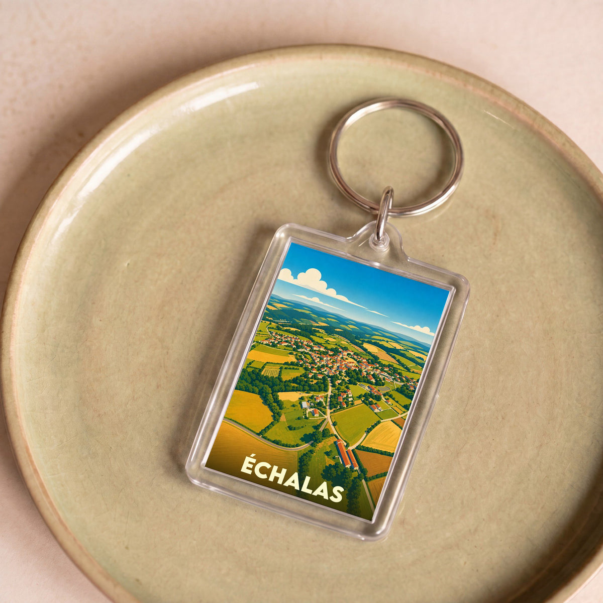 Porte-clés souvenir de la ville d'Échalas avec une illustration stylisée.