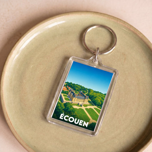 Porte-clés souvenir de la ville d'Écouen avec une illustration stylisée du château.