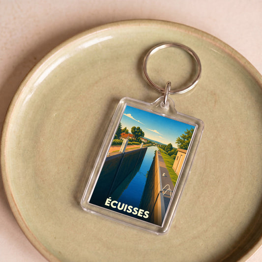 Porte-clés souvenir de la ville d'Écuisses avec une illustration stylisée de son canal.