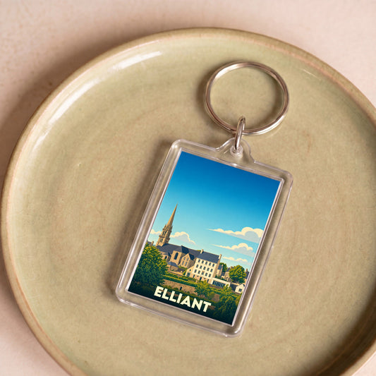 Porte-clés souvenir de la ville d'Elliant avec une illustration stylisée de son église et de ses bâtiments.
