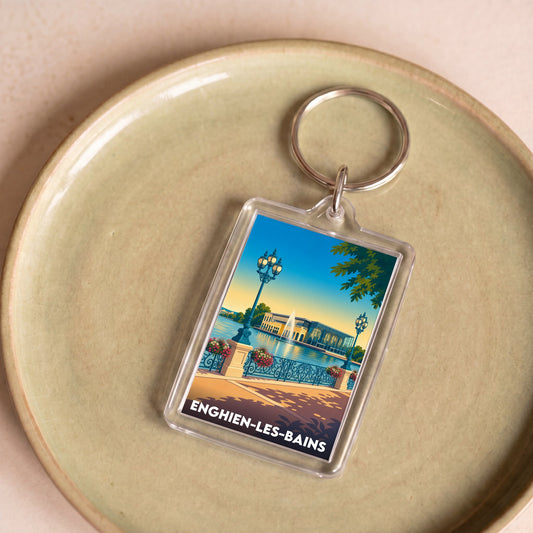 Porte-clés souvenir de la ville d'Enghien-les-Bains avec une illustration stylisée.