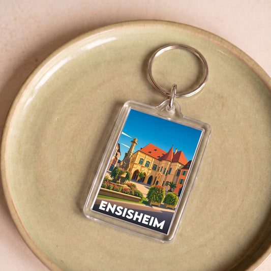 Porte-clés souvenir de la ville d'Ensisheim avec une illustration stylisée.