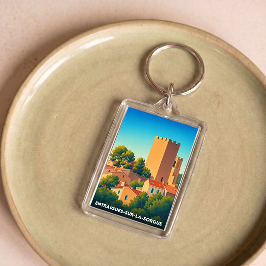 Porte-clés souvenir de la ville de Entraigues-sur-la-Sorgue avec une illustration stylisée.