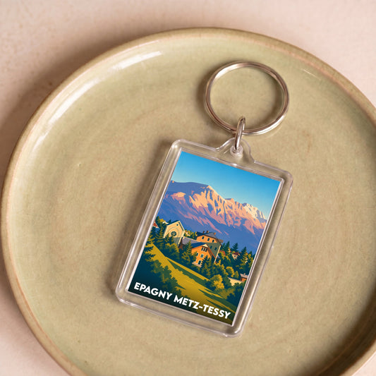 Porte-clés souvenir de la ville d'Epagny Metz-Tessy avec une illustration stylisée de montagne.