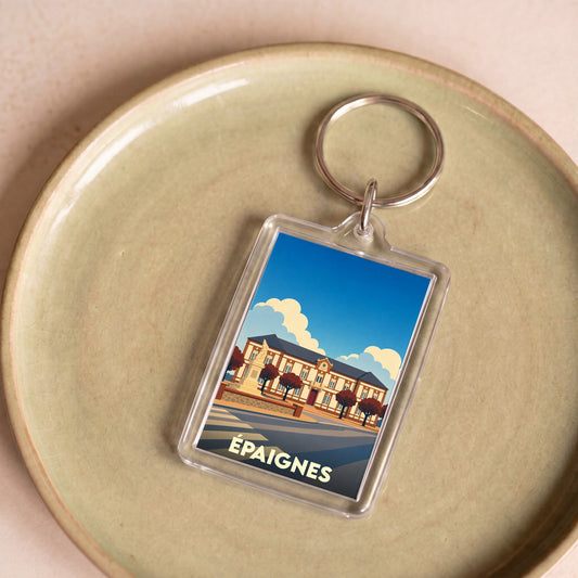 Porte-clés souvenir de la ville d'Épaignes avec une illustration stylisée de sa mairie.