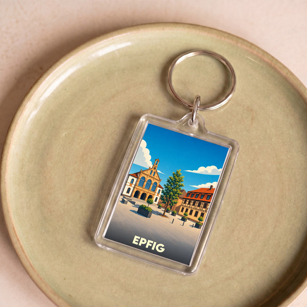 Porte-clés souvenir de la ville de Epfig avec une illustration stylisée.
