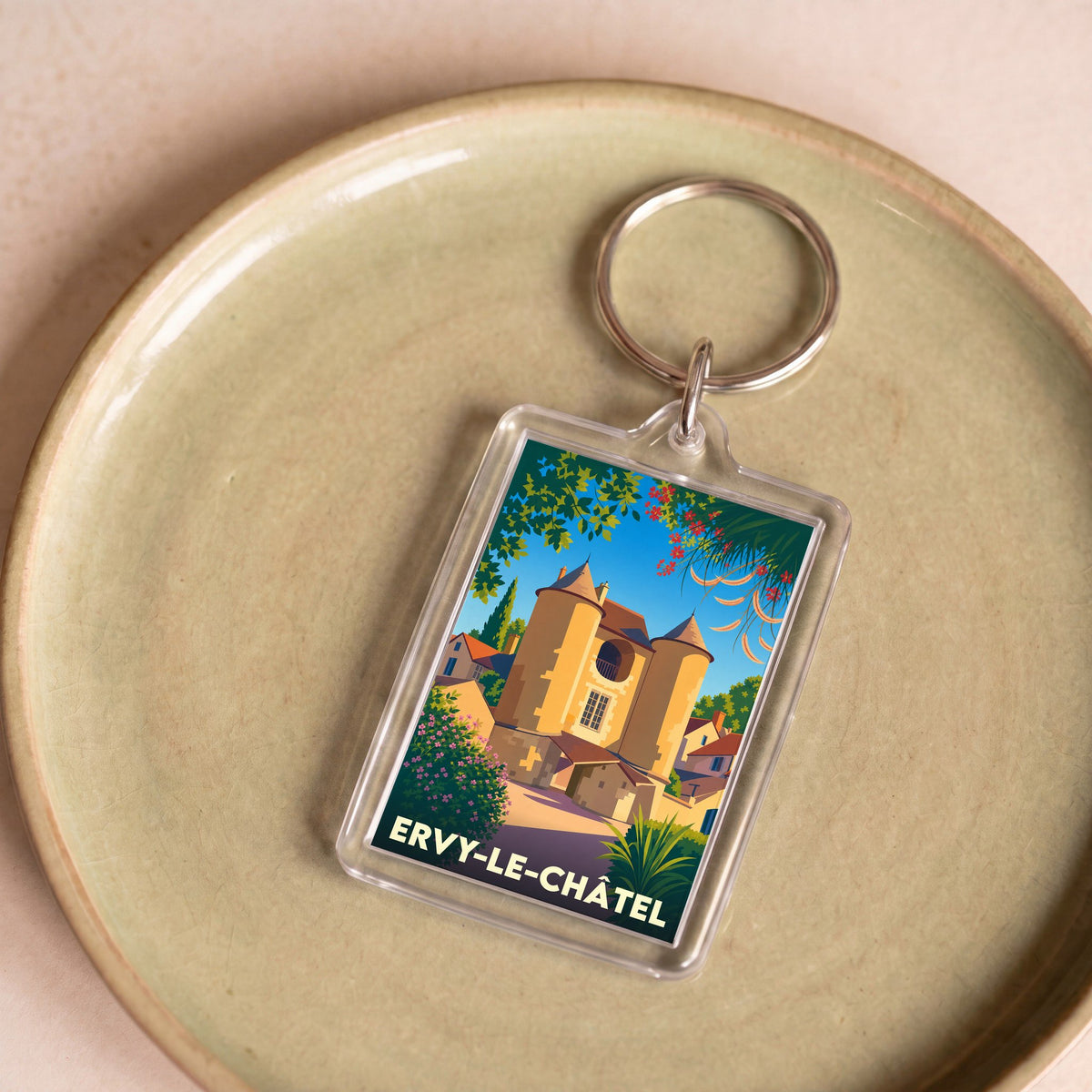 Porte-clés souvenir de la ville d'Ervy-le-Châtel avec une illustration stylisée de sa porte médiévale.