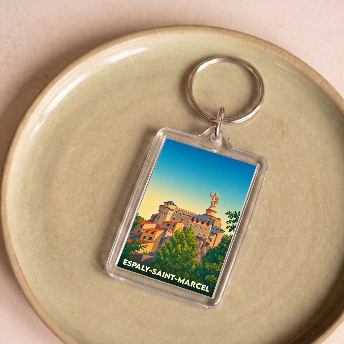 Porte-clés souvenir de la ville de Espaly-Saint-Marcel avec une illustration stylisée.