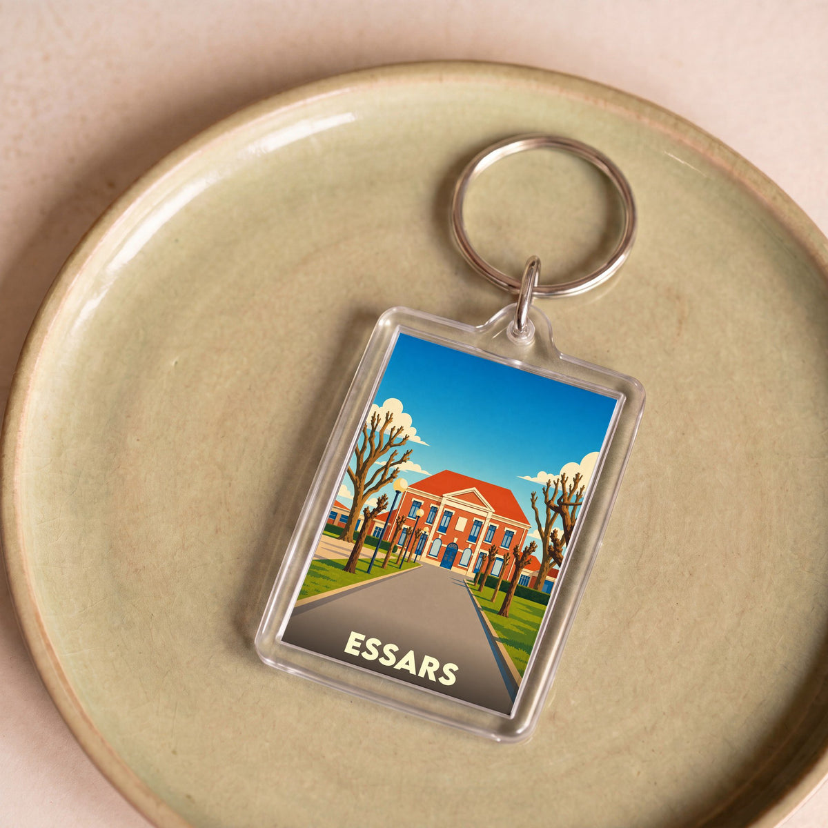 Porte-clés souvenir de la ville d'Essars avec une illustration stylisée de sa mairie.