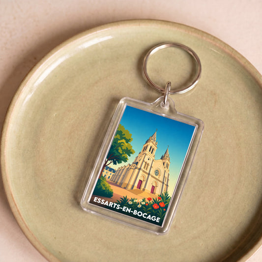 Porte-clés souvenir de la ville de Essarts-en-Bocage avec une illustration stylisée de son église.