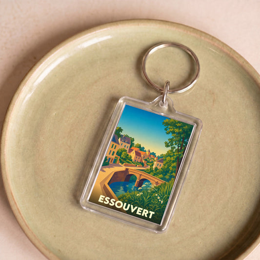Porte-clés souvenir de la ville de Essouvert avec une illustration stylisée d'un pont en pierre.