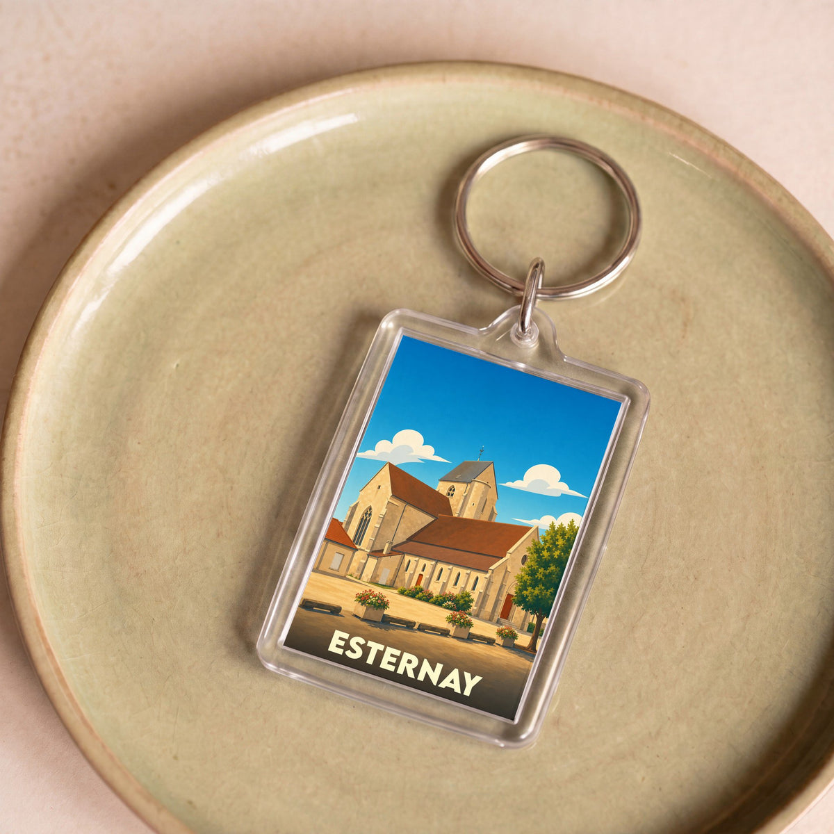 Porte-clés souvenir de la ville de Esternay avec une illustration stylisée.