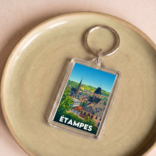 Porte-clés souvenir de la ville d’Étampes avec une illustration stylisée.