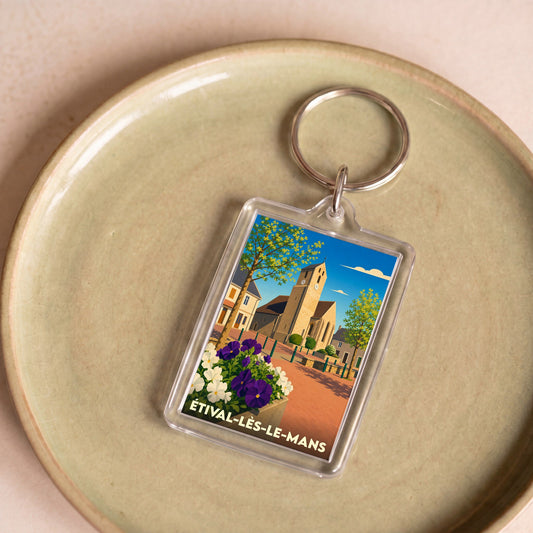 Porte-clés souvenir de la ville d'Étival-lès-le-Mans avec une illustration stylisée.