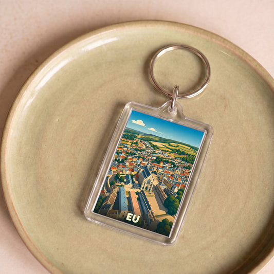 Porte-clés souvenir de la ville de Eu avec une illustration panoramique stylisée.
