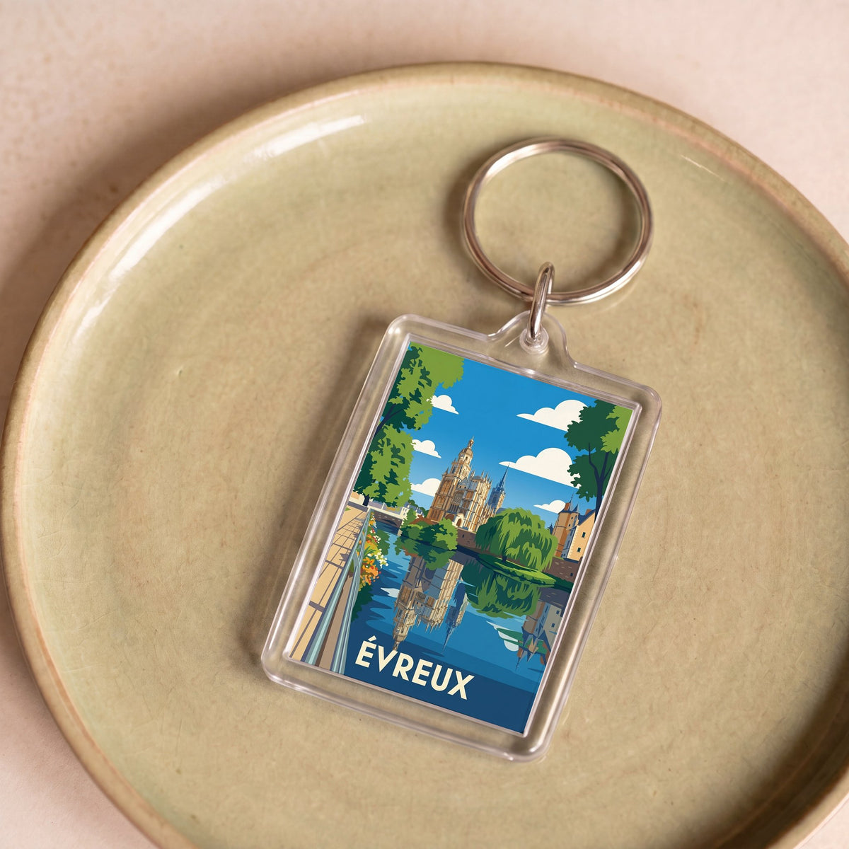 Porte-clés souvenir de la ville d'Évreux avec une illustration stylisée.