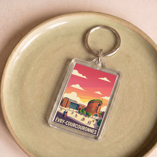 Porte-clés souvenir de la ville d'Évry-Courcouronnes avec une illustration colorée et stylisée.