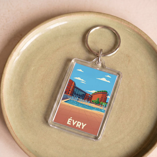 Porte-clés souvenir de la ville d'Évry avec une illustration stylisée.