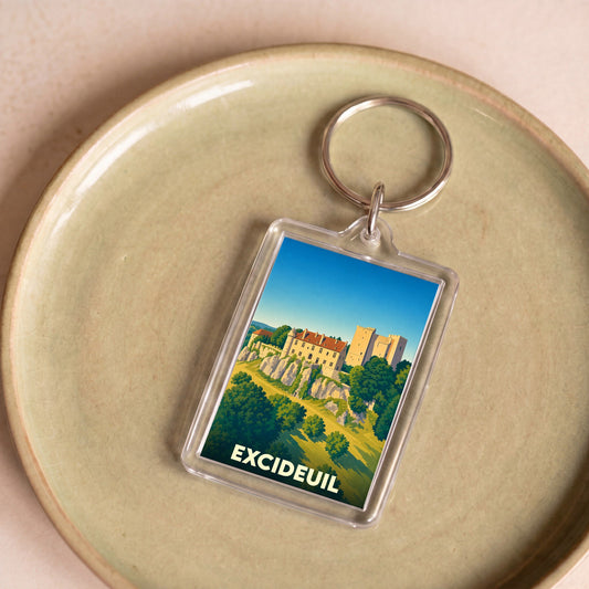Porte-clés souvenir de la ville d'Excideuil avec une illustration stylisée de son château.