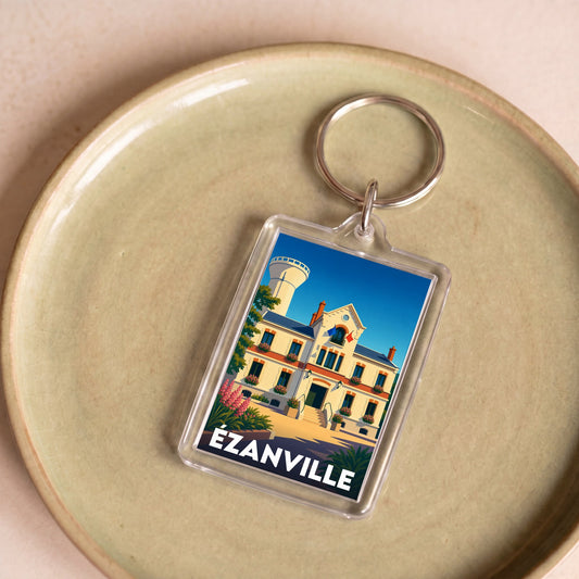 Porte-clés souvenir de la ville d'Ézanville avec une illustration stylisée de son hôtel de ville.