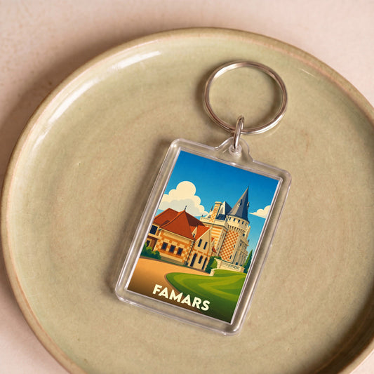 Porte-clés souvenir de la ville de Famars avec une illustration stylisée d'un château.