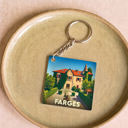 Porte-clés souvenir de la ville de Farges avec une illustration stylisée.