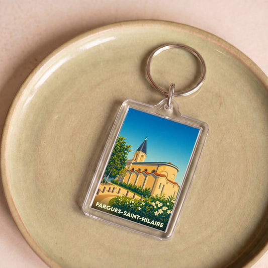 Porte-clés souvenir de la ville de Fargues-Saint-Hilaire avec une illustration stylisée.