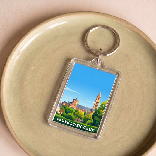 Porte-clés souvenir de la ville de Fauville-en-Caux avec une illustration stylisée de son église.