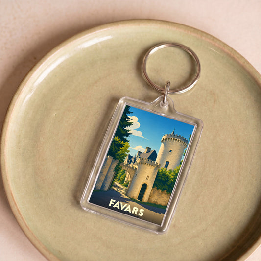 Porte-clés souvenir de la ville de Favars avec une illustration stylisée d'un château.