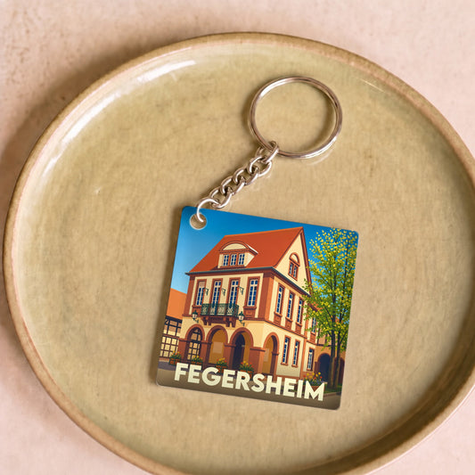 Porte-clés souvenir de la ville de Fegersheim avec une illustration stylisée.
