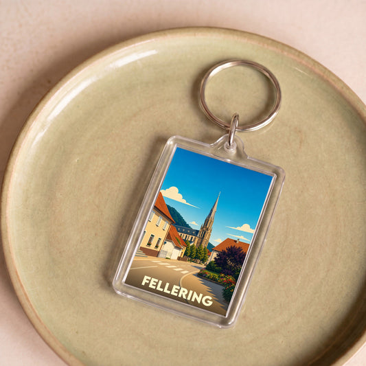 Porte-clés souvenir de la ville de Fellering avec une illustration stylisée.
