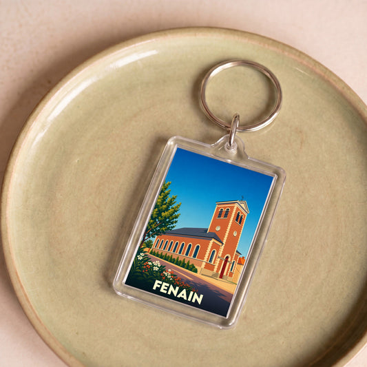 Porte-clés souvenir de la ville de Fenain avec une illustration stylisée de son église.