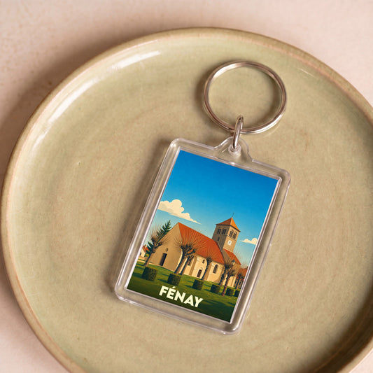 Porte-clés souvenir de la ville de Fénay avec une illustration stylisée de son église.