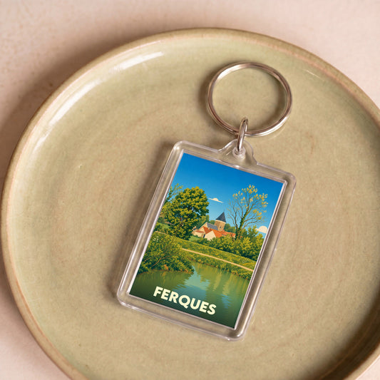 Porte-clés souvenir de la ville de Ferques avec une illustration stylisée de son paysage.