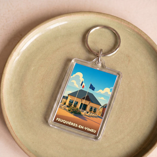 Porte-clés souvenir de la ville de Feuquières-en-Vimeu avec une illustration stylisée de sa mairie.