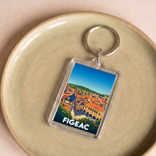 Porte-clés souvenir de la ville de Figeac avec une illustration stylisée de ses toits.