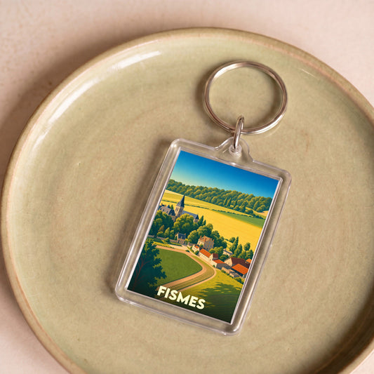 Porte-clés souvenir de la ville de Fismes avec une illustration stylisée de son paysage champêtre.
