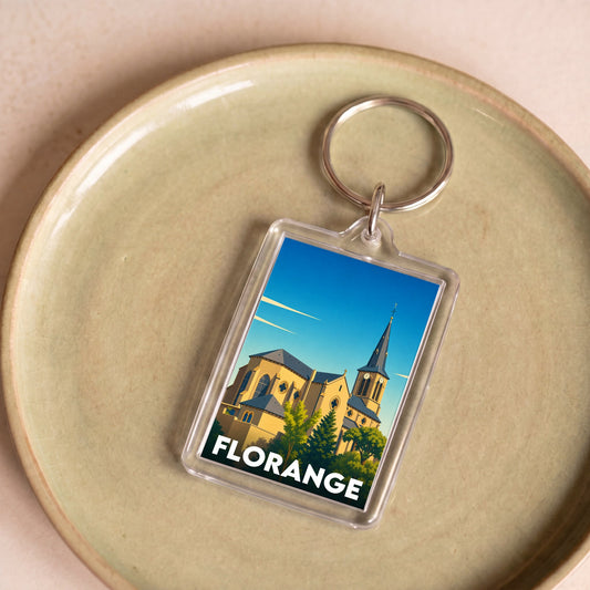 Porte-clés souvenir de la ville de Florange avec une illustration stylisée de son église.